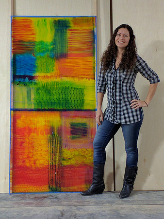 Artist Wendi La Fey with painting, "Fire Dance"