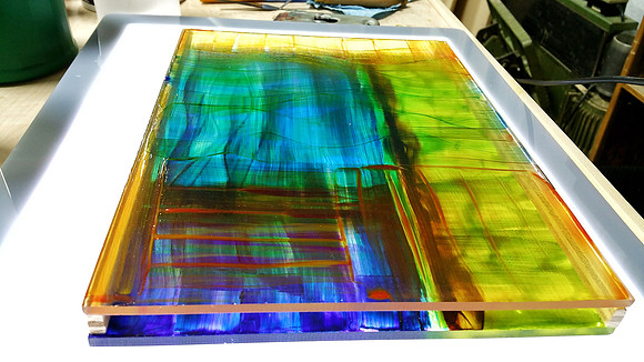 A view from the side of the layers of paintings.