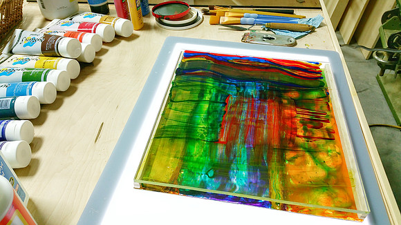 A view from the side of the layers of paintings.